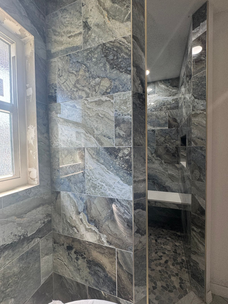 bathroom wall outside walk in shower with Elysium Mystic Ocean 12x24 porcelain tile