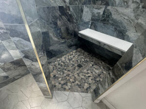 walk-in shower wall with Elysium Mystic Ocean 12x24 porcelain tile - built in shower bench