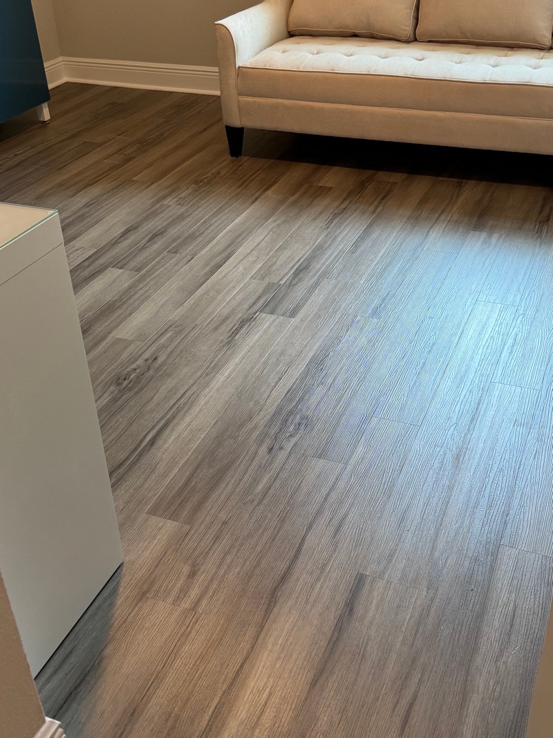 white sofa on Ashton Woods Oak COREtec Luxury Vinyl flooring