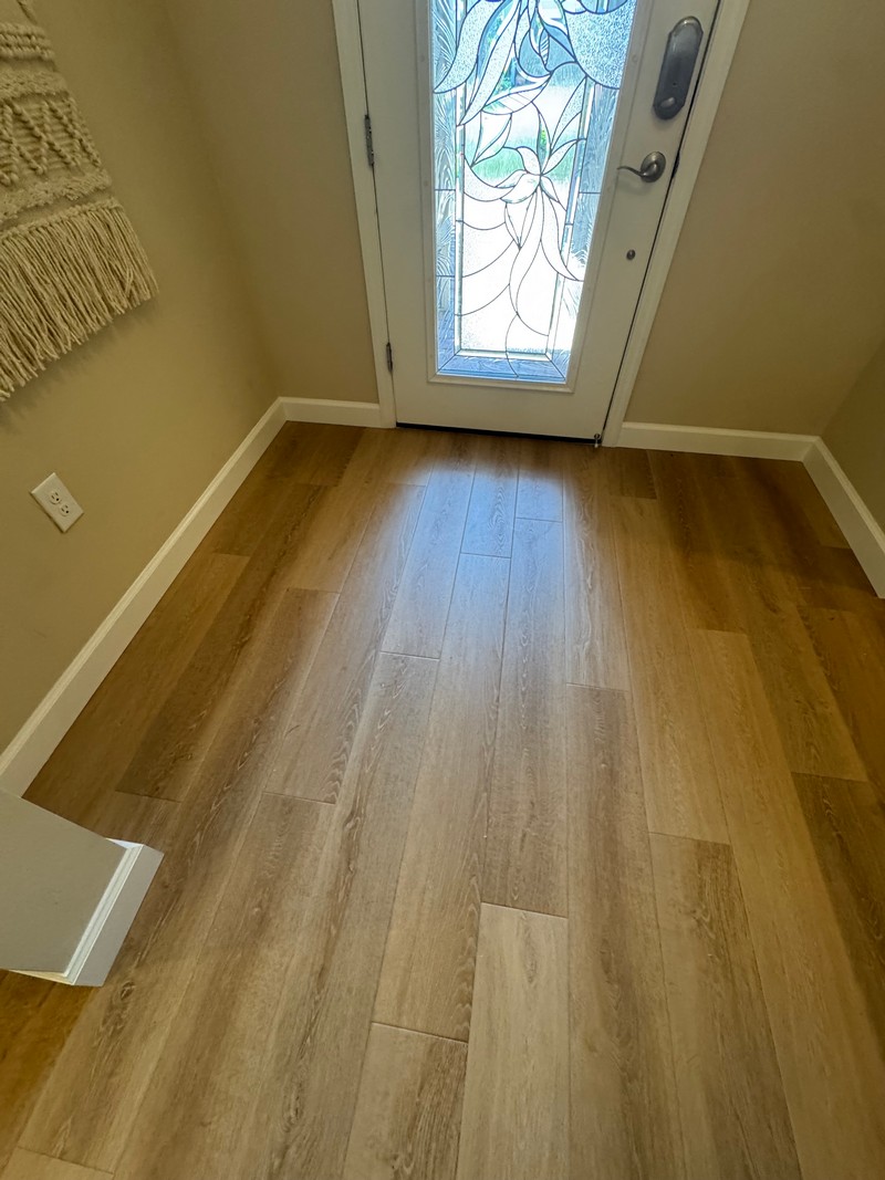 Wheat Oak COREtec Luxury Vinyl flooring in an entry hallway