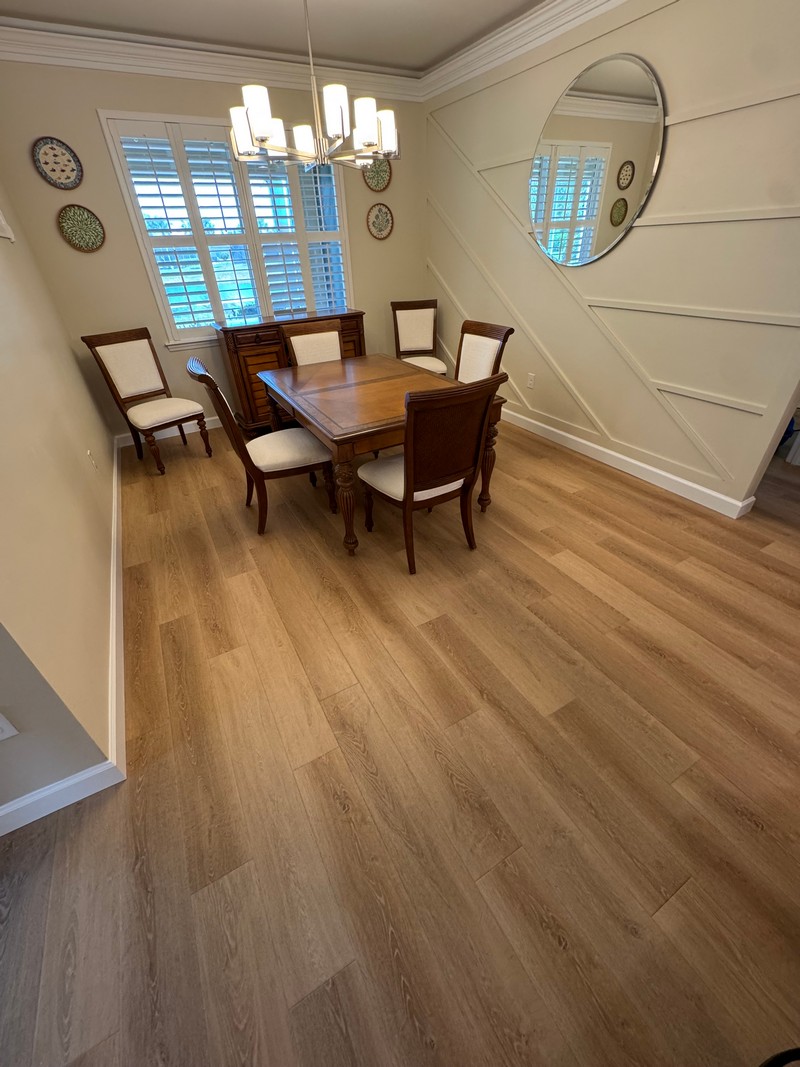 Wheat Oak COREtec Luxury Vinyl flooring in a dining room